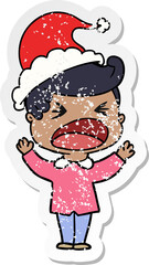 distressed sticker cartoon of a shouting man wearing santa hat