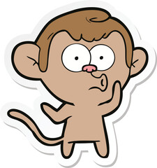 sticker of a cartoon hooting monkey