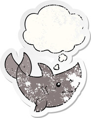 cartoon shark and thought bubble as a distressed worn sticker