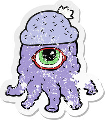 retro distressed sticker of a cartoon alien wearing hat