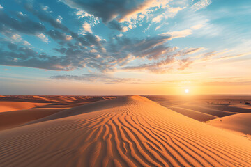 Sunset over the arid landscape of the desert, showcasing golden sand dunes under an orange sky during a hot summer evening