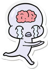 sticker of a cartoon big brain alien crying