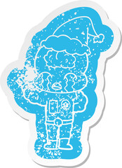 cartoon distressed sticker of a big brain alien crying wearing santa hat