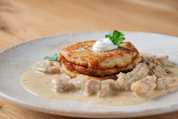 Potato pancakes with mushroom sauce