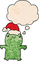 cute cartoon frog wearing christmas hat and thought bubble in grunge texture pattern style