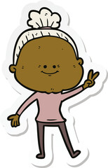 sticker of a cartoon happy old woman