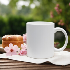 Coffee mug, a white cup on a table with buns and flowers. Styled photo, product mockup - 725934308