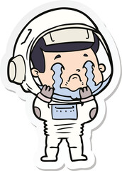 sticker of a cartoon crying astronaut