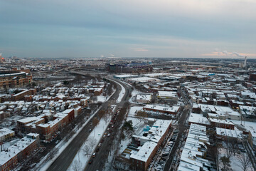 Drone View of Baltimore City Houses with Snow Covered Roofs at Sunset