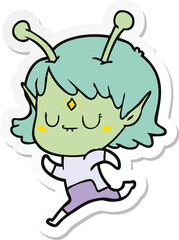 sticker of a cartoon alien girl