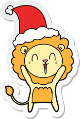 laughing lion sticker cartoon of a wearing santa hat