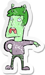 retro distressed sticker of a cartoon unhappy alien