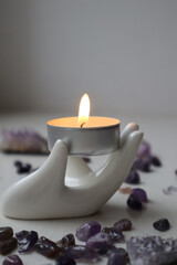 Candle light and Amethyst kiesel. Relaxation background. 