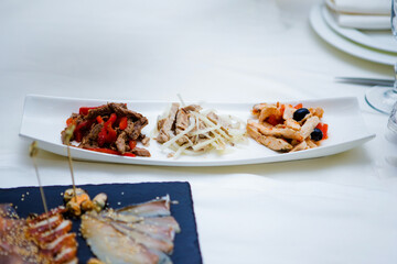 White plate with meat and vegetables