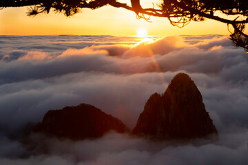 The sun sets on the Sea of Clouds in the North Sea area of Huangshan's Yellow Mountains.