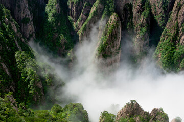 Clouds float inside the West Sea (Xihai) Grand Canyon of Huangshan Yellow Mountains.