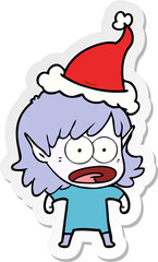 sticker cartoon of a shocked elf girl wearing santa hat