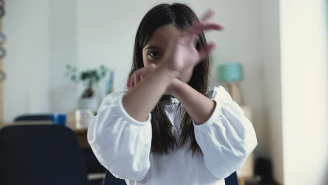 Little Girl with Arms Crossed in X, Requests to Stop by waving finger. Don't do that