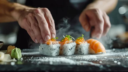 Selbstklebende Fototapeten Preparing sushi, perfectionism, close-up view of hands making sushi © DB Media