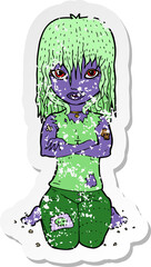 retro distressed sticker of a cartoon vampire girl