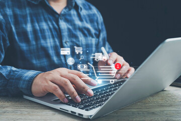 shopping online, order in online store, shopping on internet, ,Shopper using computer laptop to input order with trolley credit card delivery truck for online shopping and e-commerce technology.