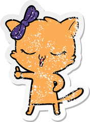 distressed sticker of a cartoon cat with bow on head