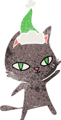 retro cartoon of a cat staring wearing santa hat