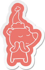 happy cartoon  sticker of a polar bear wearing santa hat