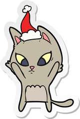 confused sticker cartoon of a cat wearing santa hat