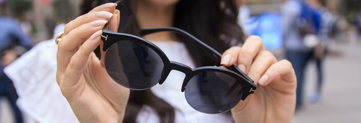 Woman hand sunglasses