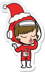 sticker cartoon of a pretty astronaut girl wearing santa hat