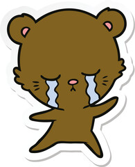 sticker of a crying cartoon bear