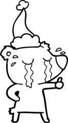 line drawing of a crying bear wearing santa hat