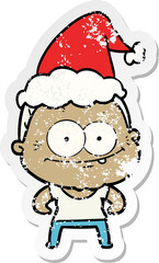 distressed sticker cartoon of a happy old woman wearing santa hat