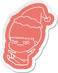 cartoon  sticker of a boy wearing santa hat