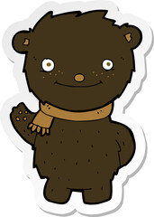 sticker of a cartoon cute black bear