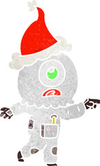 retro cartoon of a cyclops alien spaceman pointing wearing santa hat