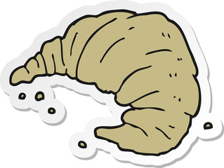 sticker of a cartoon croissant