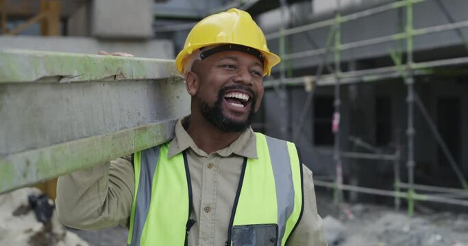 Walking, construction worker or builder carrying material or cement for architecture design or building. Smile, industrial development or happy black man greeting in engineering renovation project
