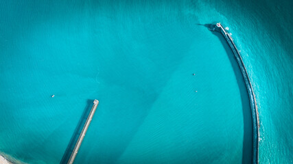 Aerial view of lighthouse in blue waters of Newhaven, East Sussex, UK