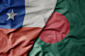 big waving national colorful flag of bangladesh and national flag of chile .
