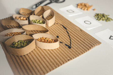 Montessori and Sensory Development, A child plays with natural materials and sorts cereals