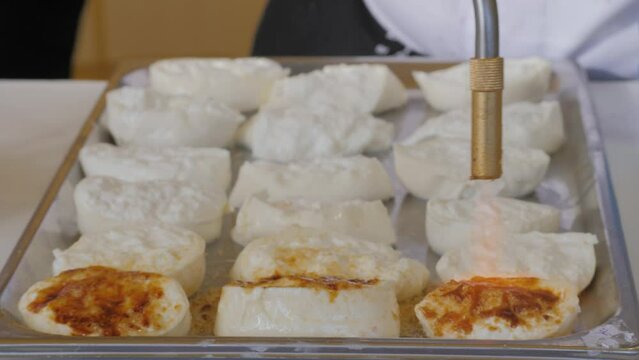  A Traditional Indonesian Street Food close-up. Uli Bakar sticky rice food.