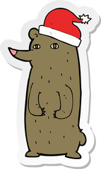 sticker of a cartoon bear in xmas hat