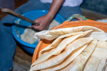 detailed view of meticulously prepared corn husks ready for wrapping Mexican tamales. 