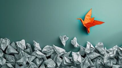 Concept of new idea and creative thinking as a symbol of innovation and inspiration metaphor as a group of crumpled papers with one different paper transforming into an origami bird in flight.