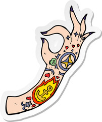 sticker of a cartoon tattoo arm
