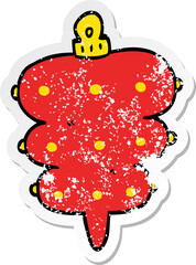 distressed sticker of a cartoon christmas decoration