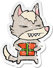 distressed sticker of a angry christmas wolf cartoon