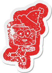 happy cartoon distressed sticker of a robot wearing santa hat